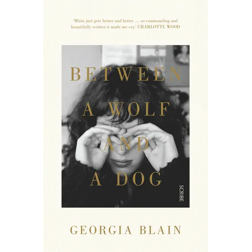 Between a Wolf and a Dog - Paperback
